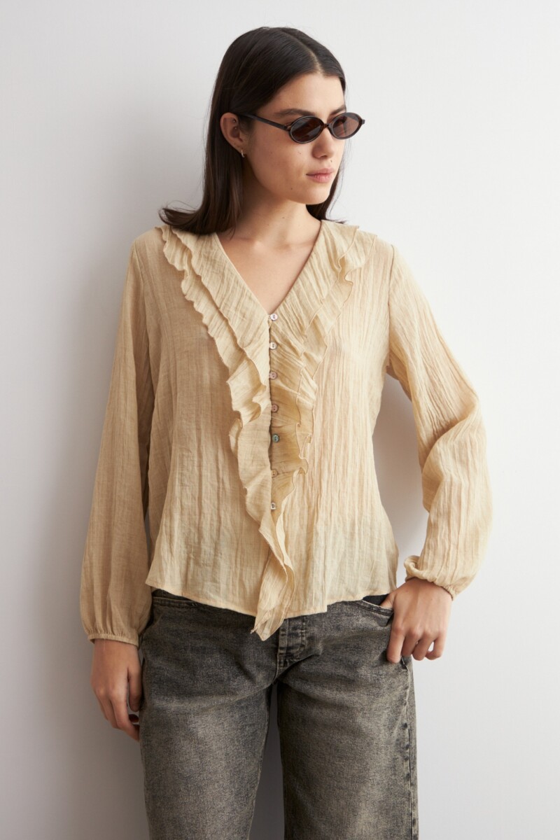 Blusa con volados beige