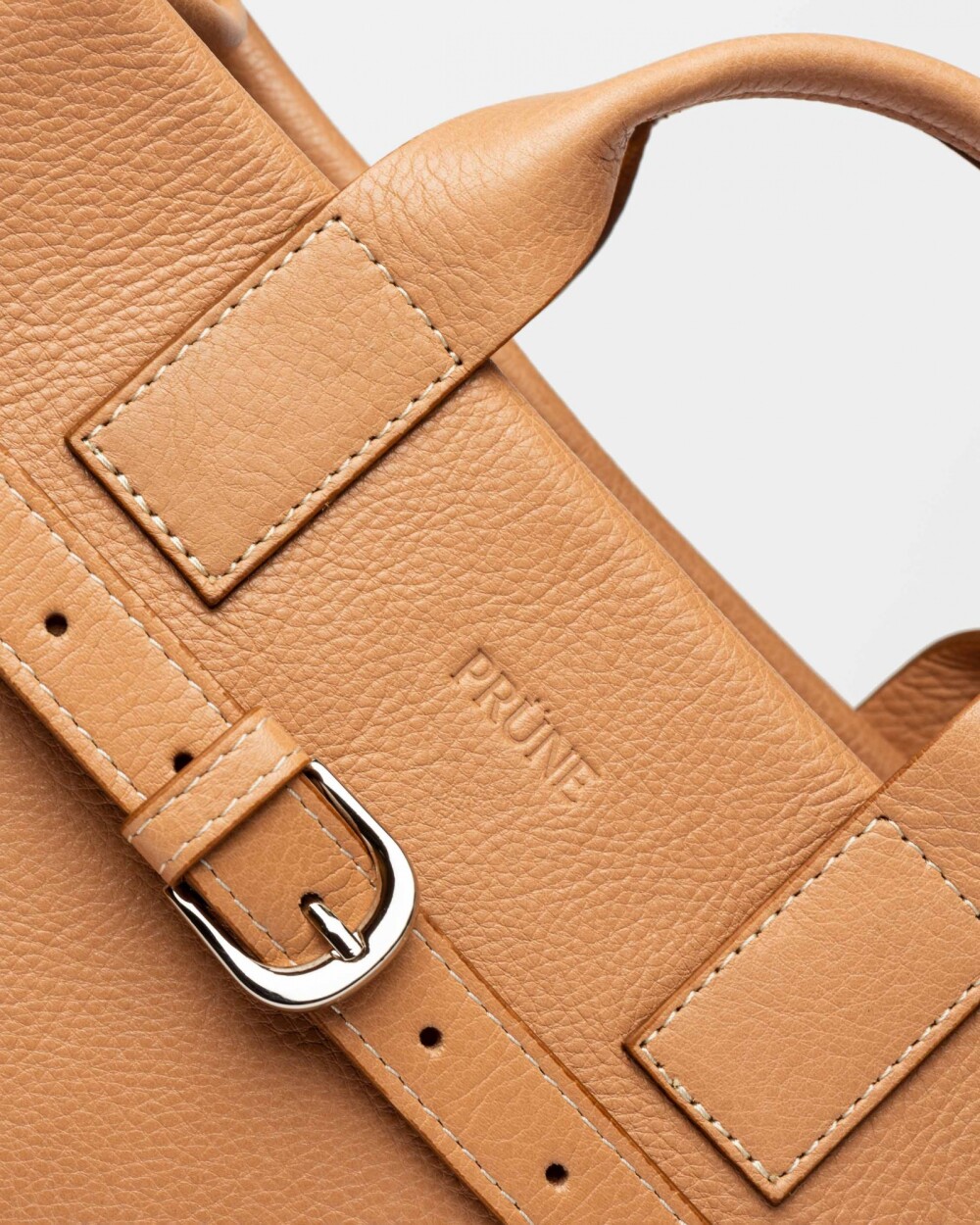 Cartera de mano Capri en cuero liso vegetal Vaqueta