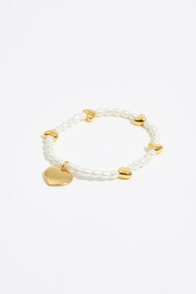 PULSERA ELÁSTICA PERLAS Y CORA Oro