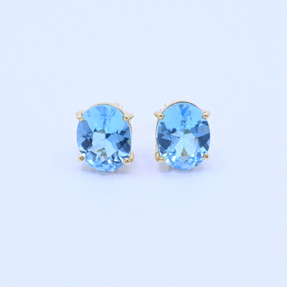Caravanas oro 18k con topacios azules oval engarce 4 puntas. Caravanas oro 18k con topacios azules oval engarce 4 puntas.