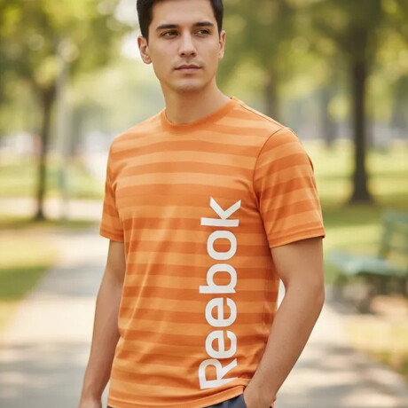 Remera Reebok D01762 Para Niños y Jóvenes Deportiva y Casual Naranja