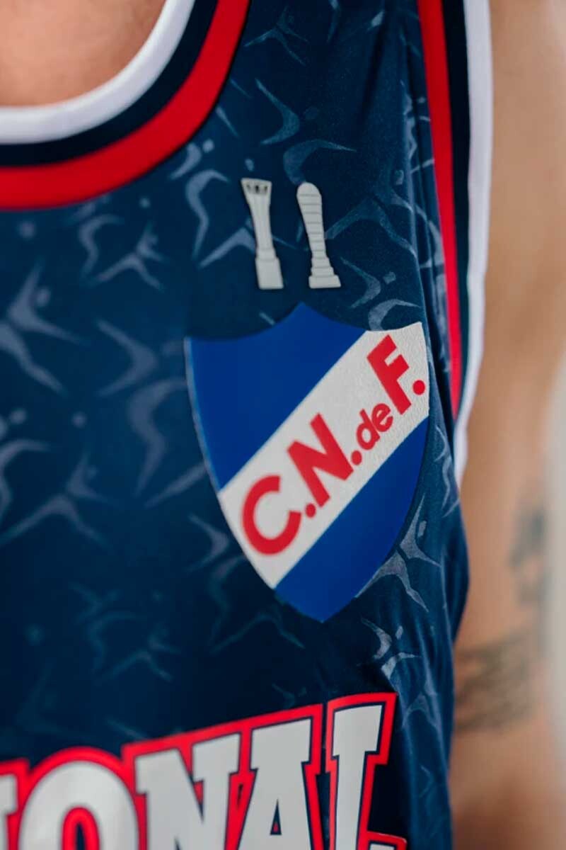 MUSCULOSA BASKET UMBRO NACIONAL OFICIAL/ALTERNAIVA 2025 Azul