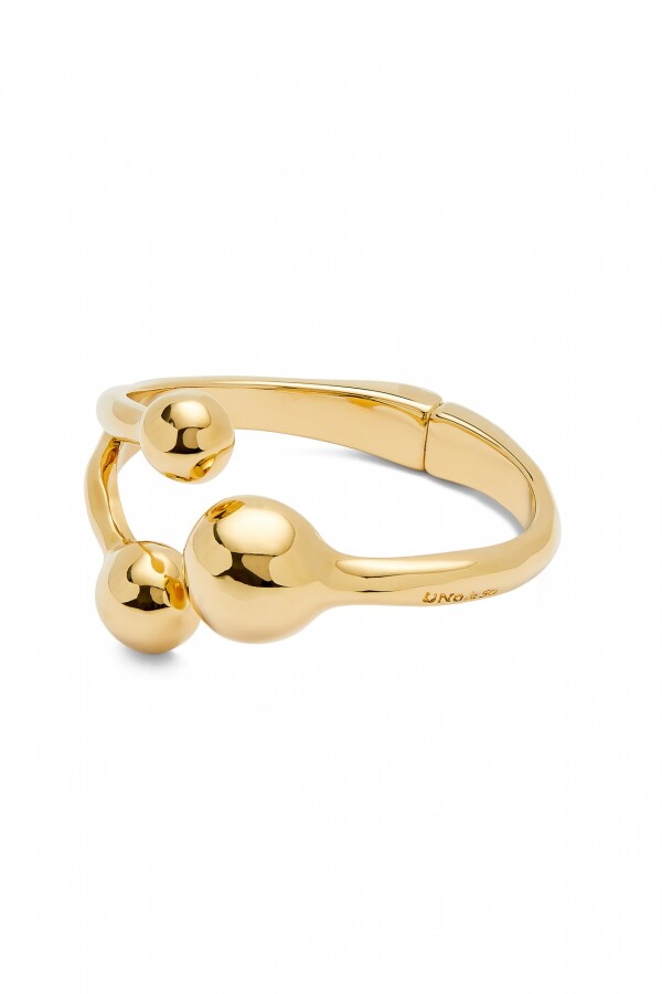 PULSERA RÍGIDA CON TRES BOLAS EN ALEACIÓN DE METALES BAÑADAS EN ORO 18K Pulsera