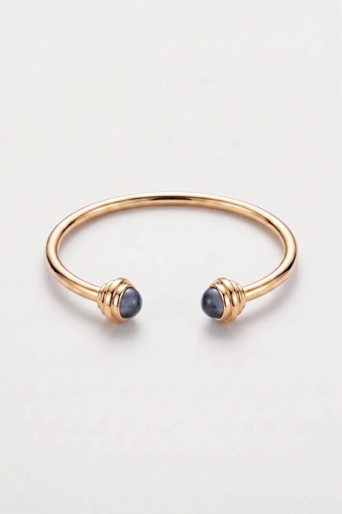 Pulsera rigida detalle dorado