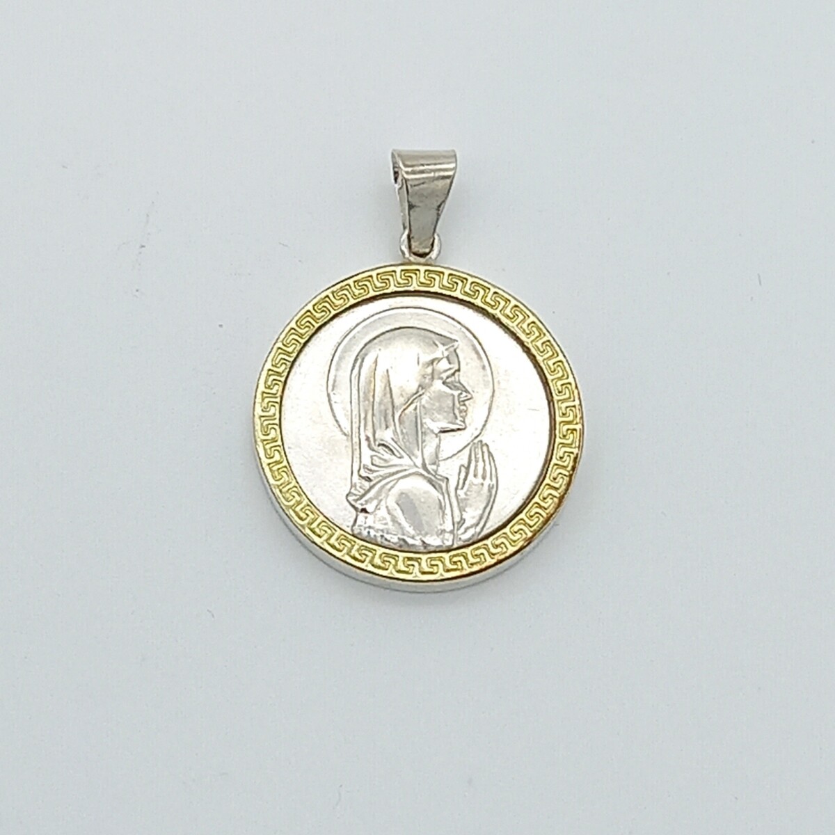 Medalla religiosa de plata y double de oro 18 ktes, VIRGEN NIÑA. 