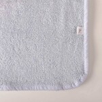 Poncho de toalla celeste con rayas 6 a 8 años