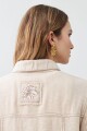 Chaqueta de lino pespuntes y parche bordado beige melange