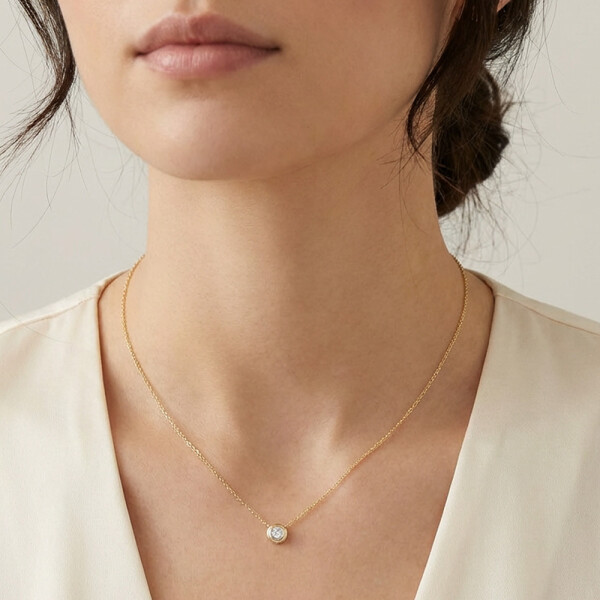 Colgante Oriana en oro amarillo 18k con brillante en doble virola Colgante Oriana en oro amarillo 18k con brillante en doble virola
