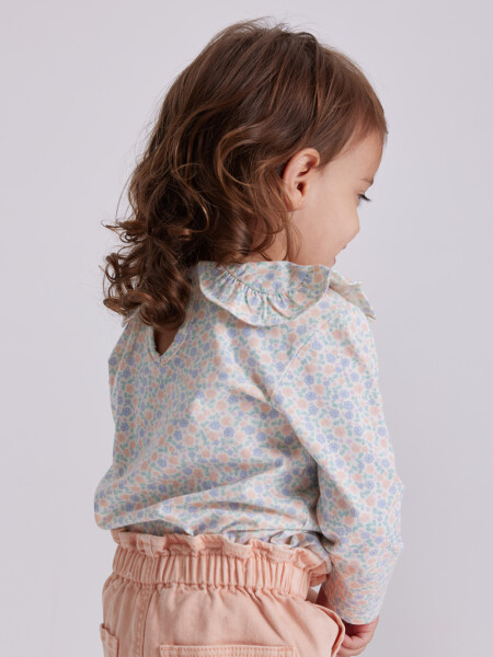 Remera manga larga cuello Flores Crema