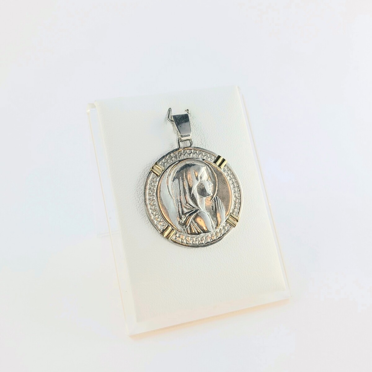 Medalla de la Virgen Niña en plata 925 con detalles en double de oro 18 ktes. 