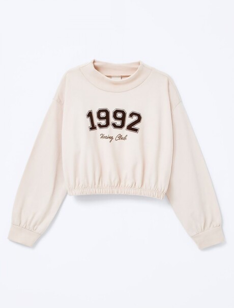 BLUSA INFANTIL CON CUELLO ALTO Y ESTAMPA BEIGE