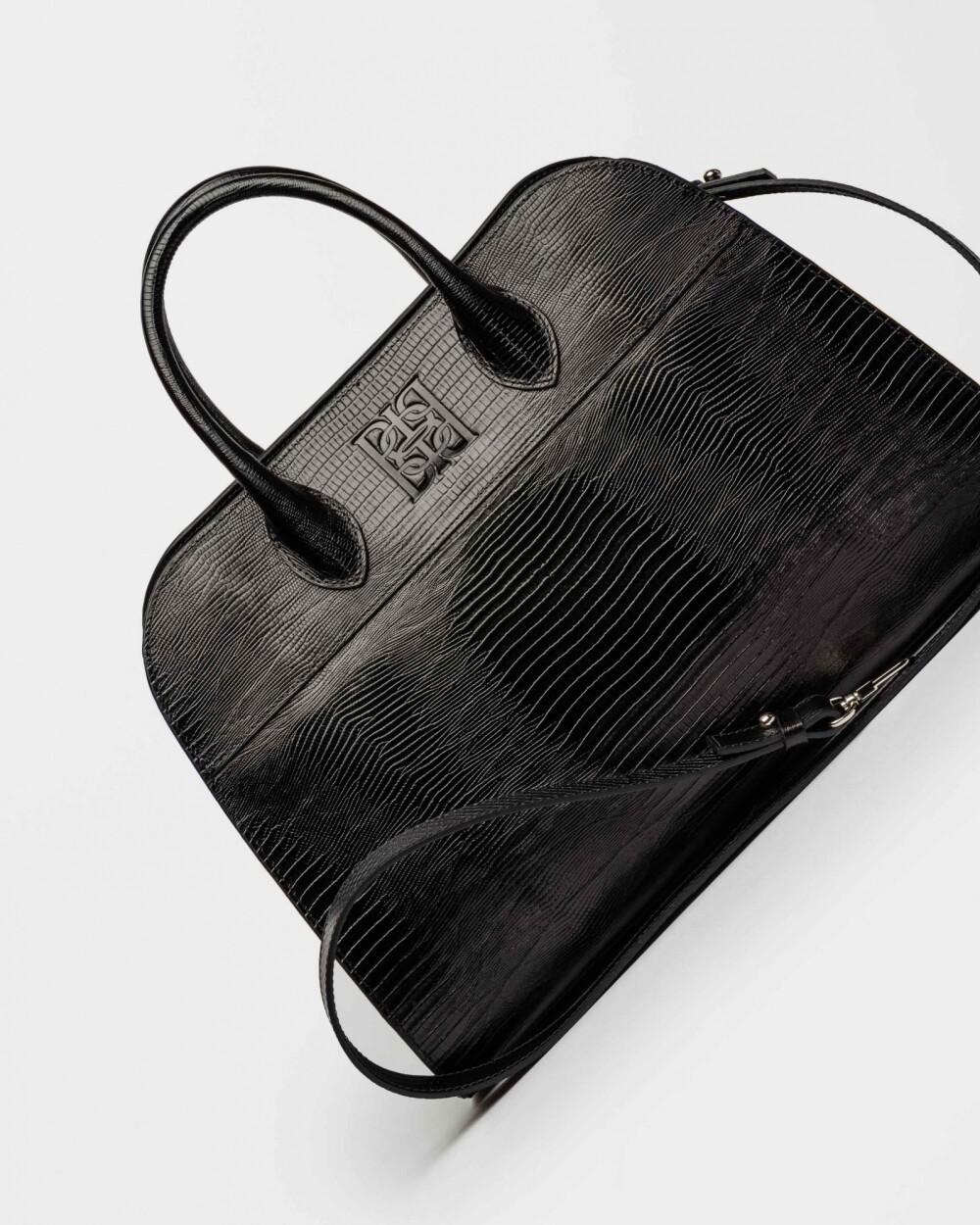 Cartera de Mano The Roots En Cuero Grabado Lagarto Negro