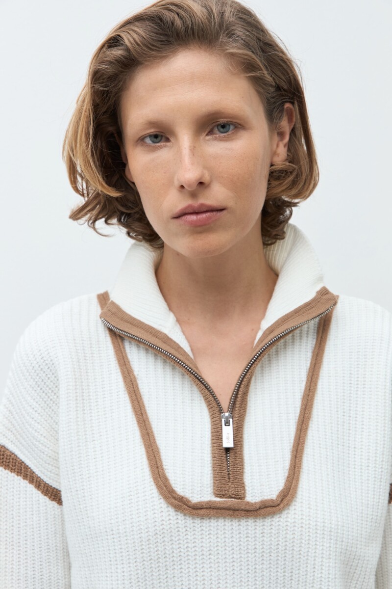 Sweater vivo en contraste crudo