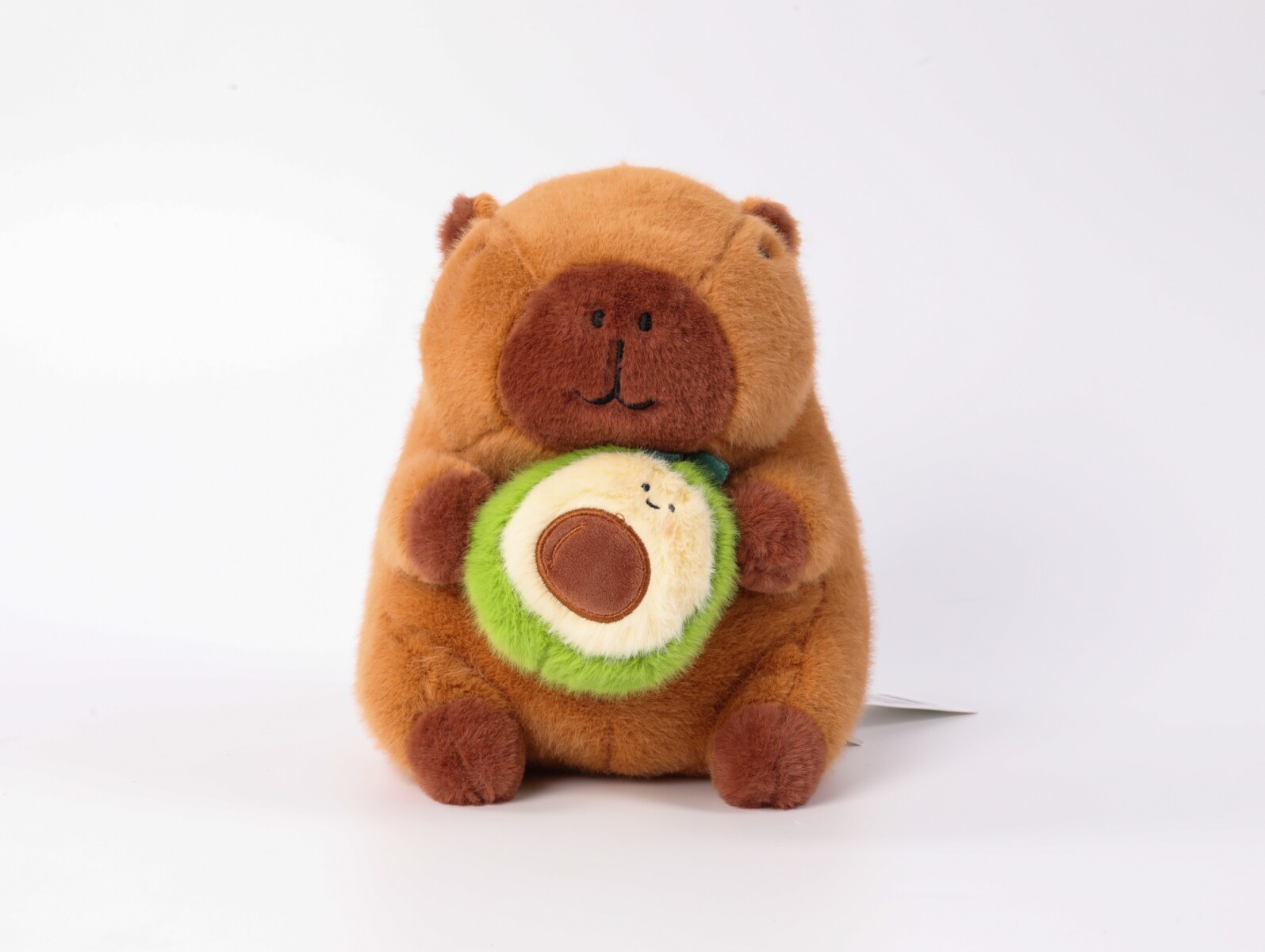 PELUCHE CAPIBARA DE 23 CM CON AGUACATE. 