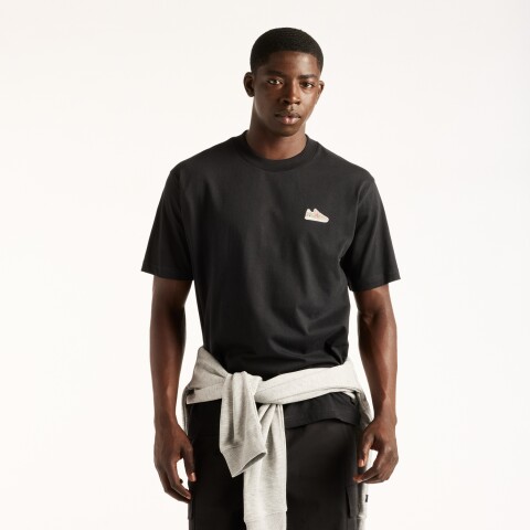 Remera New Balance de Hombre - Sticker Pack - MT62E2FFBK BLACK