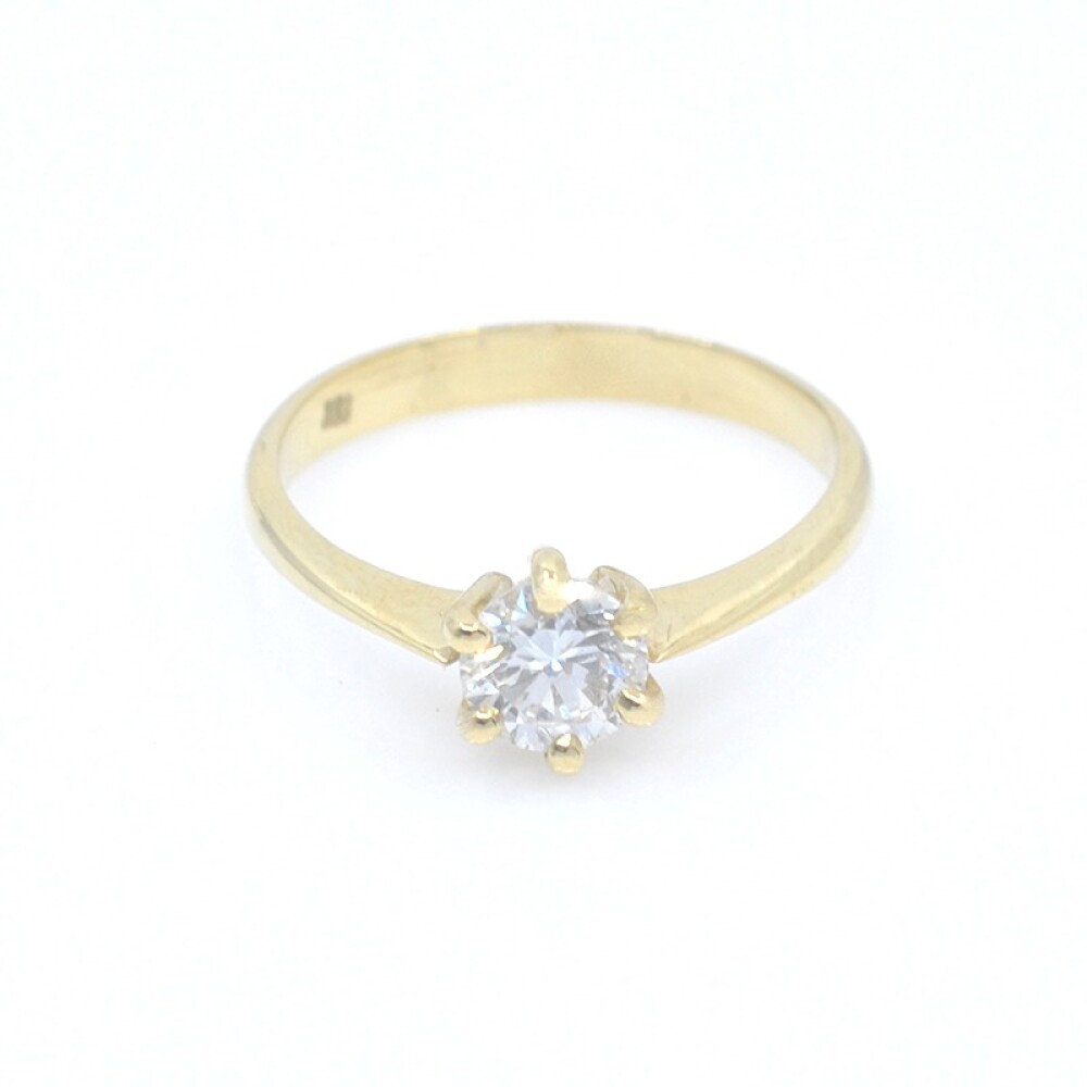 Anillo solitario en oro 18k y brillante con engarce de 6 puntas Anillo solitario en oro 18k y brillante con engarce de 6 puntas