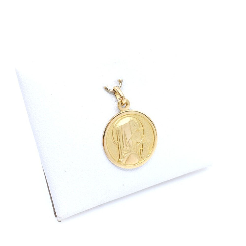 Medalla en oro 18k amarillo con imagen religiosa. Diámetro 14mm Medalla en oro 18k amarillo con imagen religiosa. Diámetro 14mm