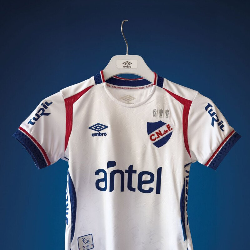 Camiseta Infantil Umbro Home Oficial 2025 Blanco - Azul Real - Rojo