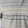 REMERA POLO RAYADA JERSEY Gris