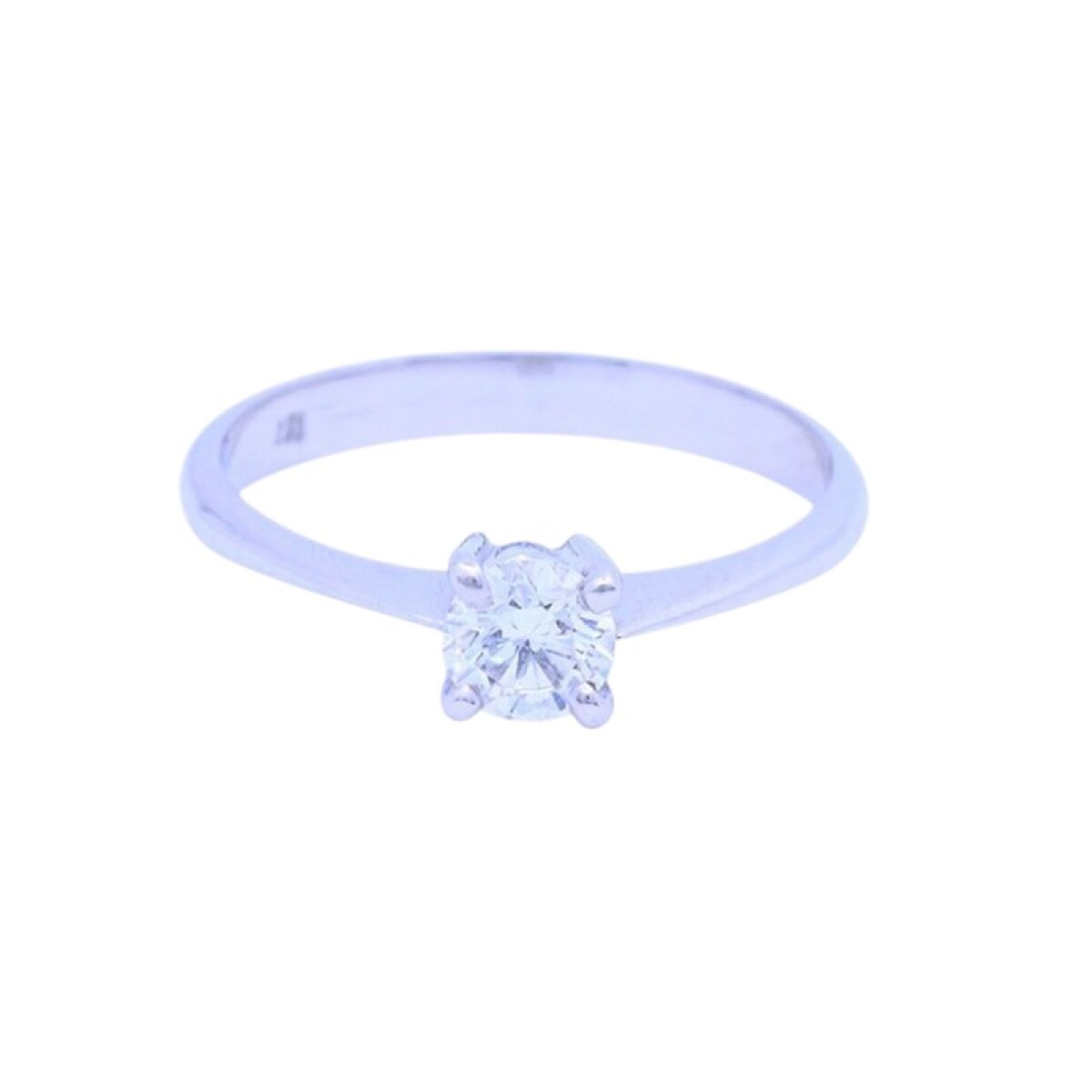 Solitario 18 k blanco con brillante engarce 4 puntas. 