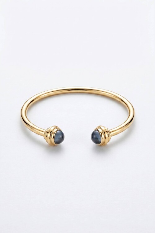 Pulsera rigida detalle dorado