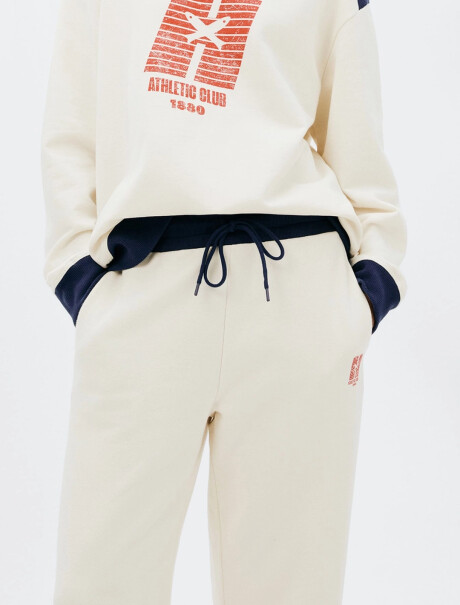 PANTALÓN DEPORTIVO CON ESTAMPA MODELO WIDE LEG BEIGE