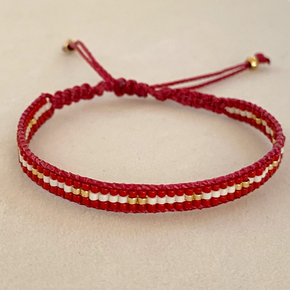 Pulsera tejida GROSELLA 