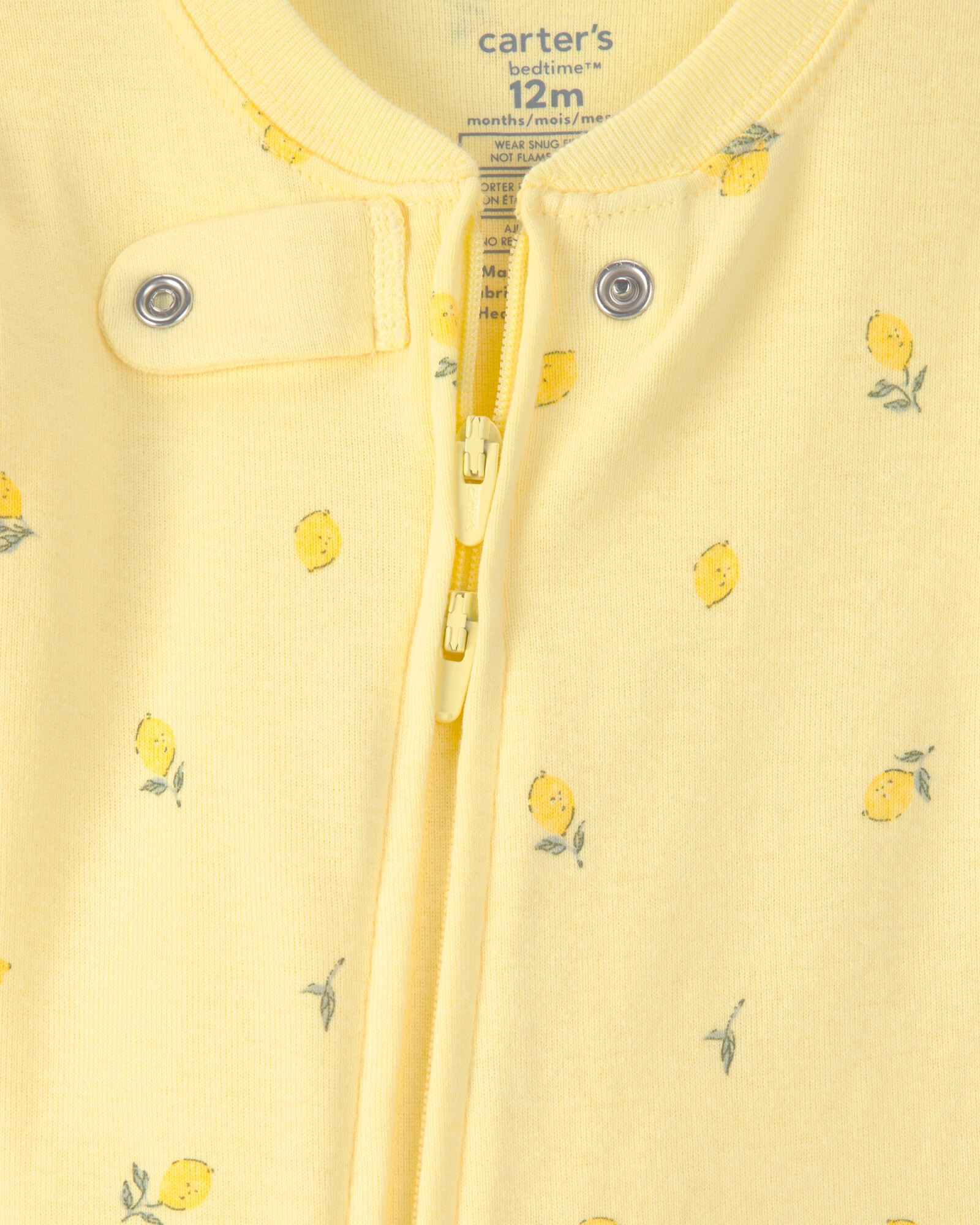 Pijama enterito de algodón con pie, amarillo, diseño limones. Talles 12-24M Pijama enterito de algodón con pie, amarillo, diseño limones. Talles 12-24M
