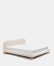 Cama desenfundable Odina bouclé crudo y patas de madera maciza de fresno acabado tono natural para colchón de 180 x 200 cm.