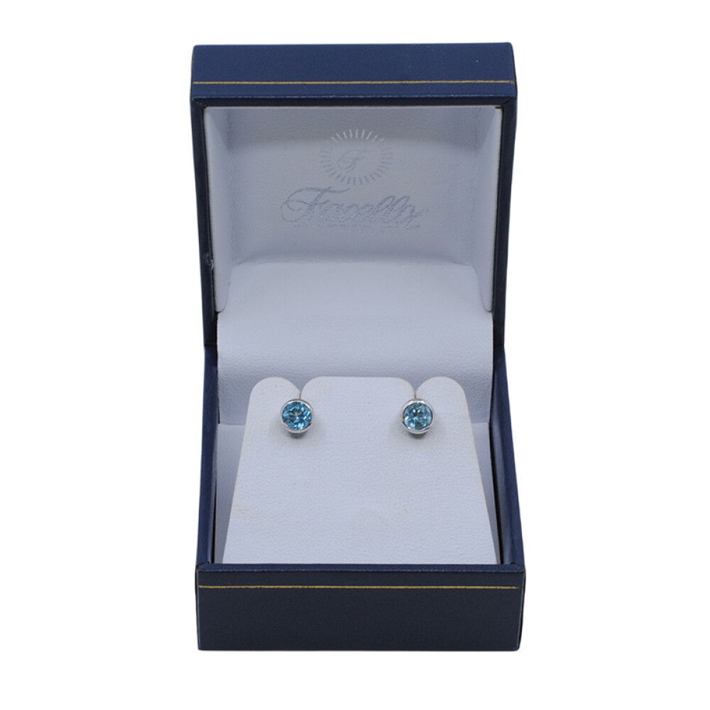 Caravanas oro 18k blanco y topacio celeste Caravanas oro 18k blanco y topacio celeste