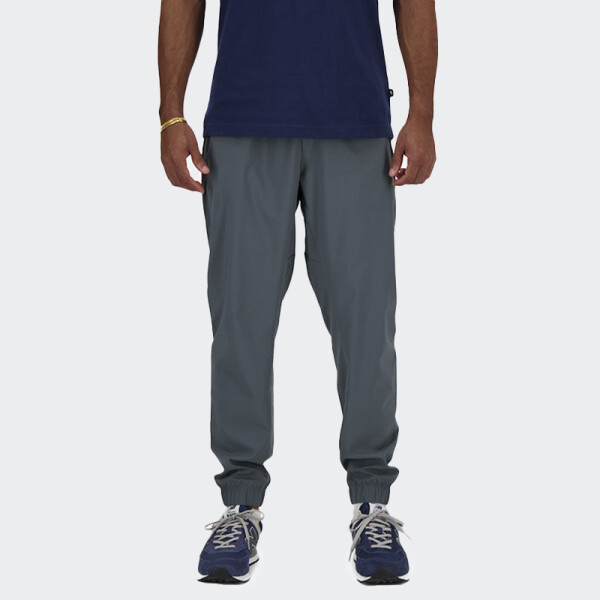 Pantalón New Balance Sport Essentials Woven Jogger Gris