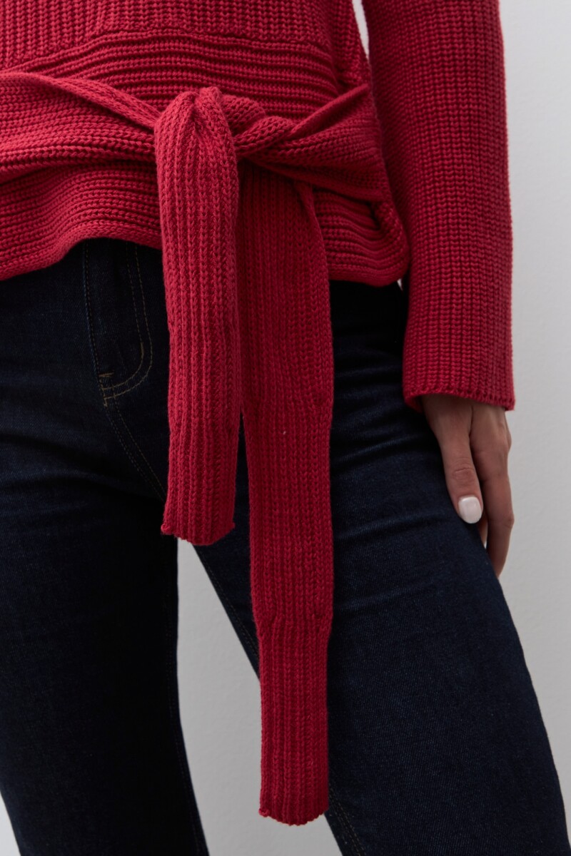 Sweater con lazo rojo