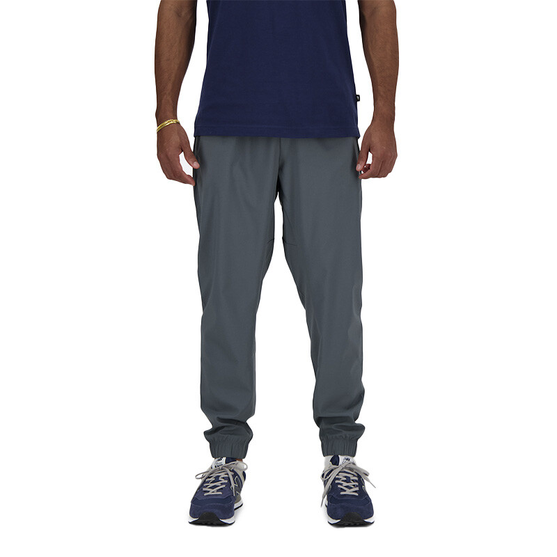 Pantalón New Balance Sport Essentials Woven Jogger Gris