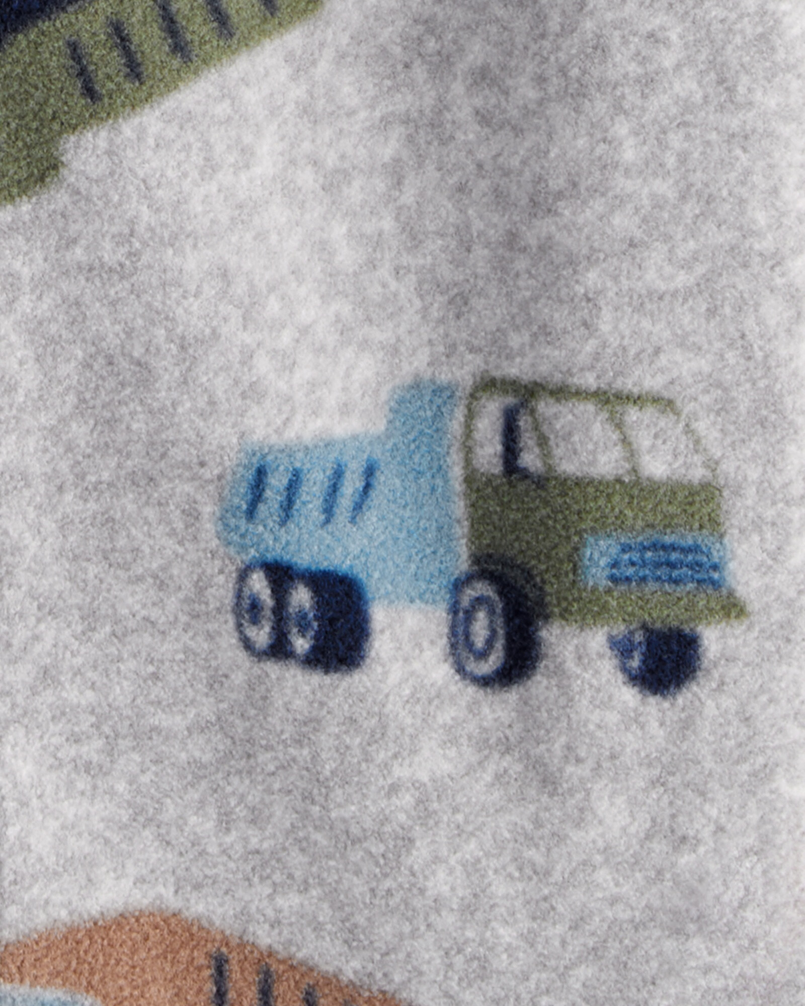 Pijama una pieza de micropolar, con pie, diseño camiones Pijama una pieza de micropolar, con pie, diseño camiones