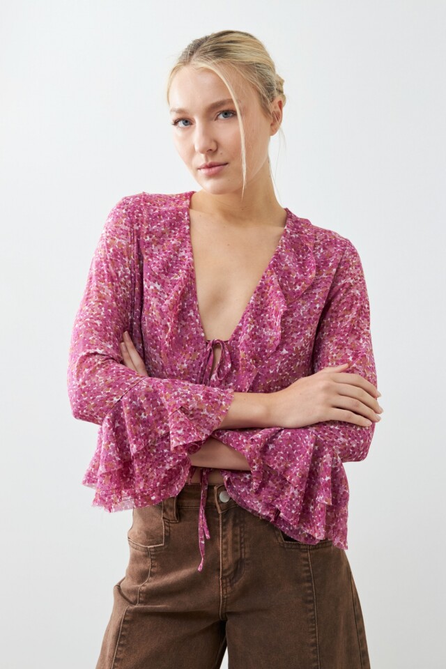 Blusa estampada con volados fucsia