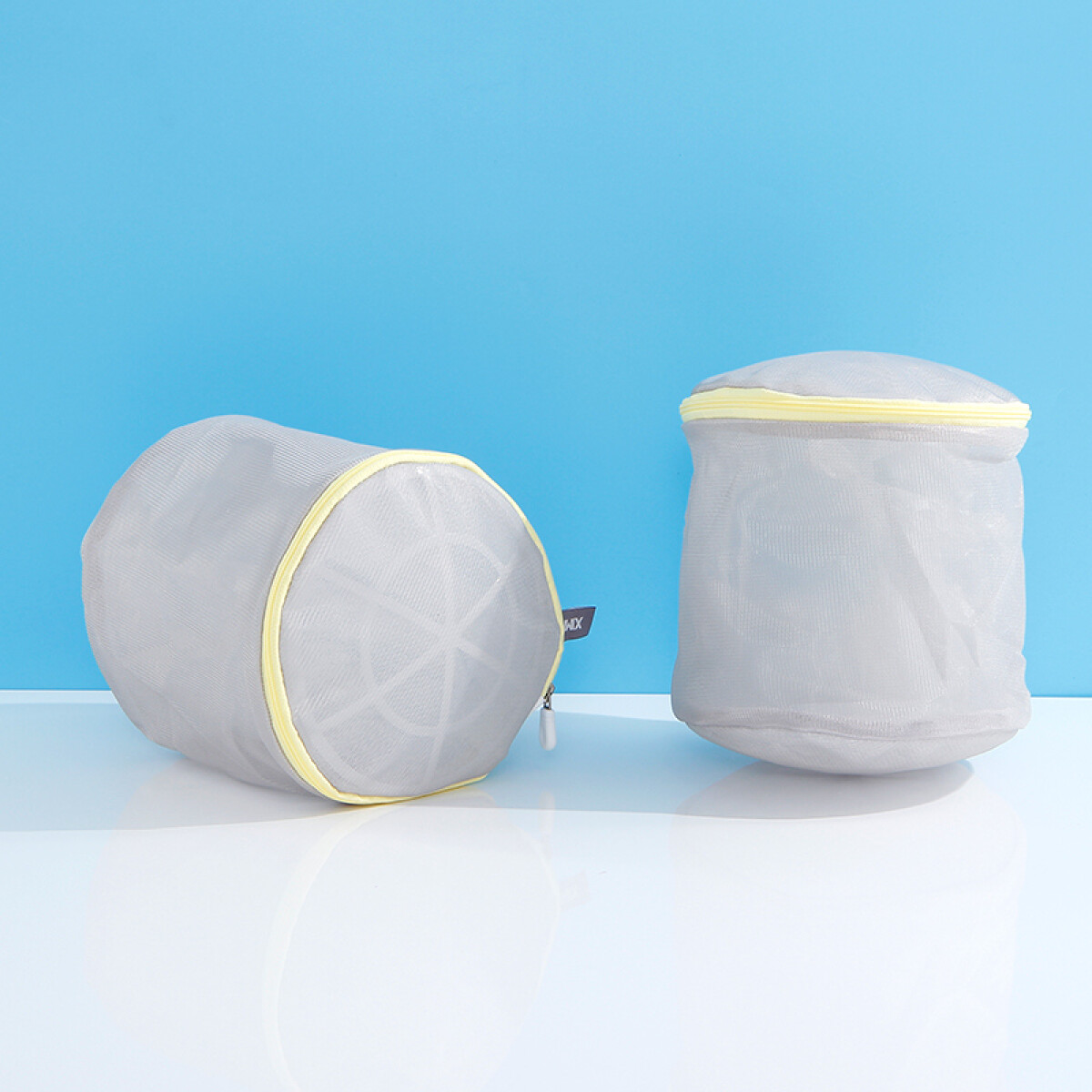 Set Bolsas Cilíndricas De Malla Gris Para Lavarropa - 2 Unid 