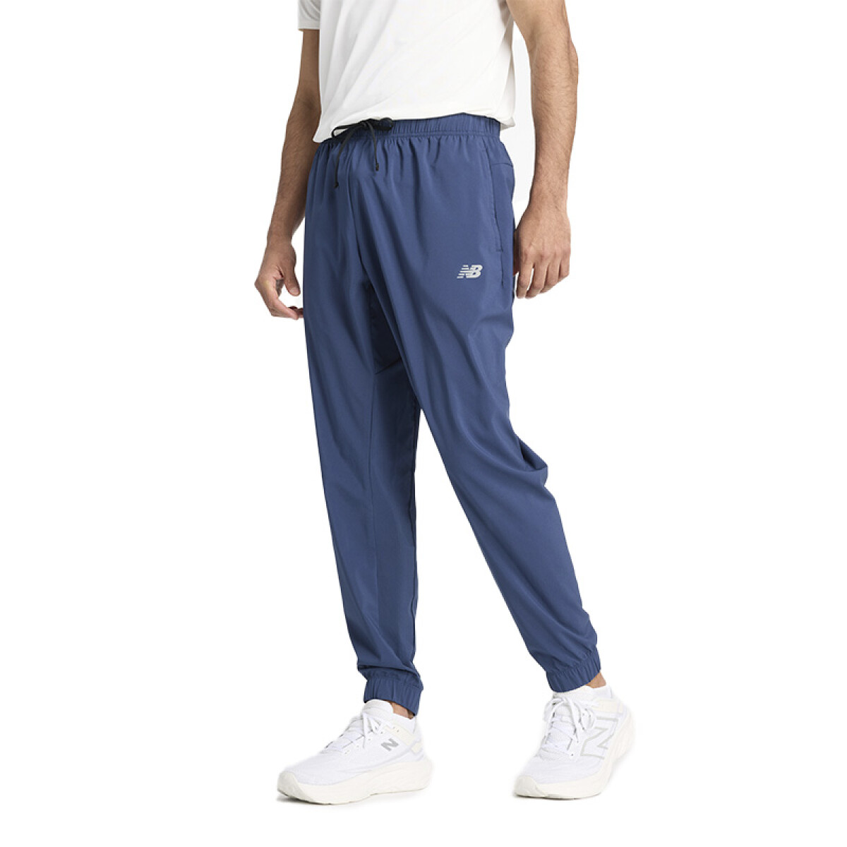 Pantalón New Balance Sport Essentials Woven Jogger - Azul 