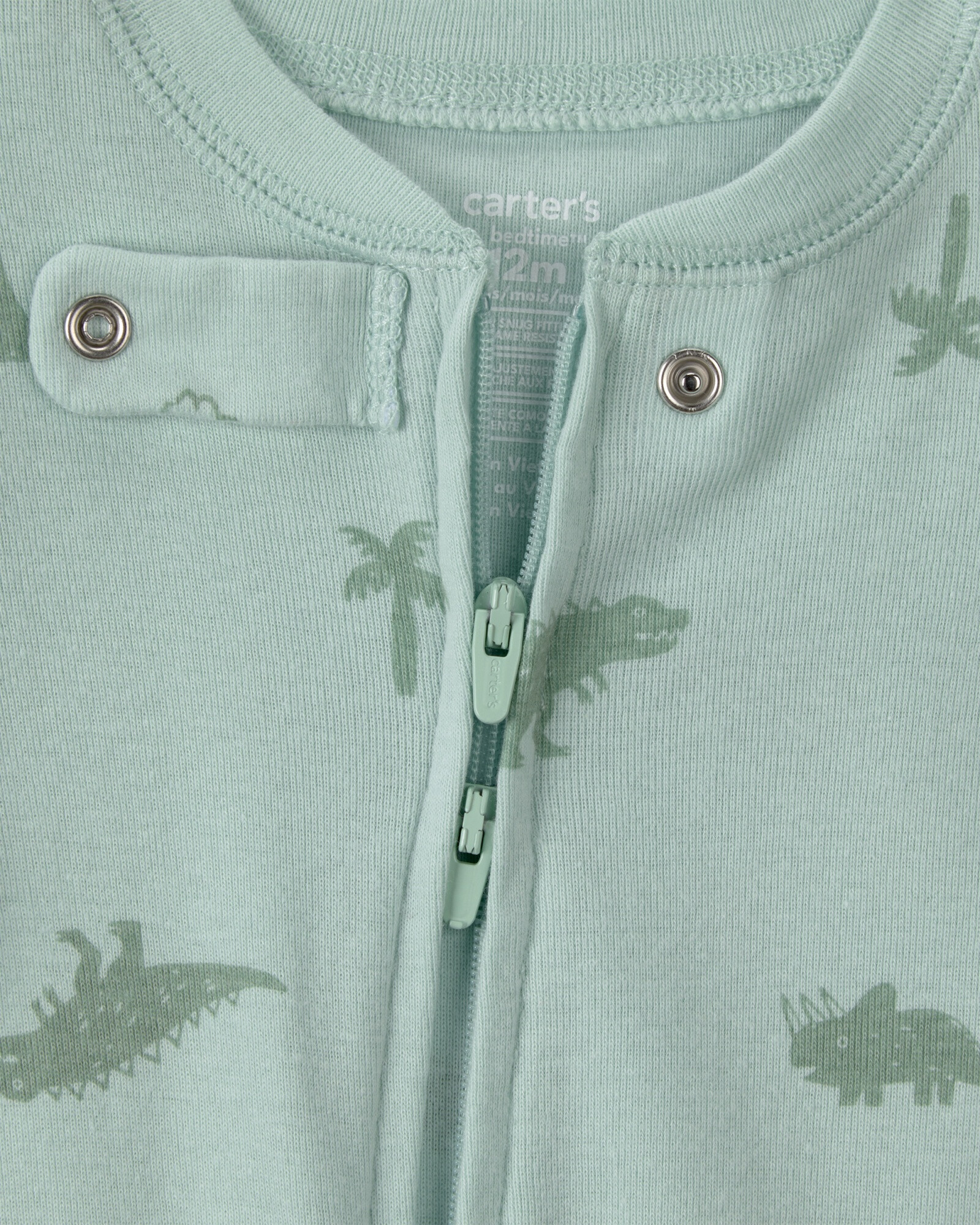 Pijama enterito de algodón con pie, verde, diseño dinos. Talles 12-24M Sin color