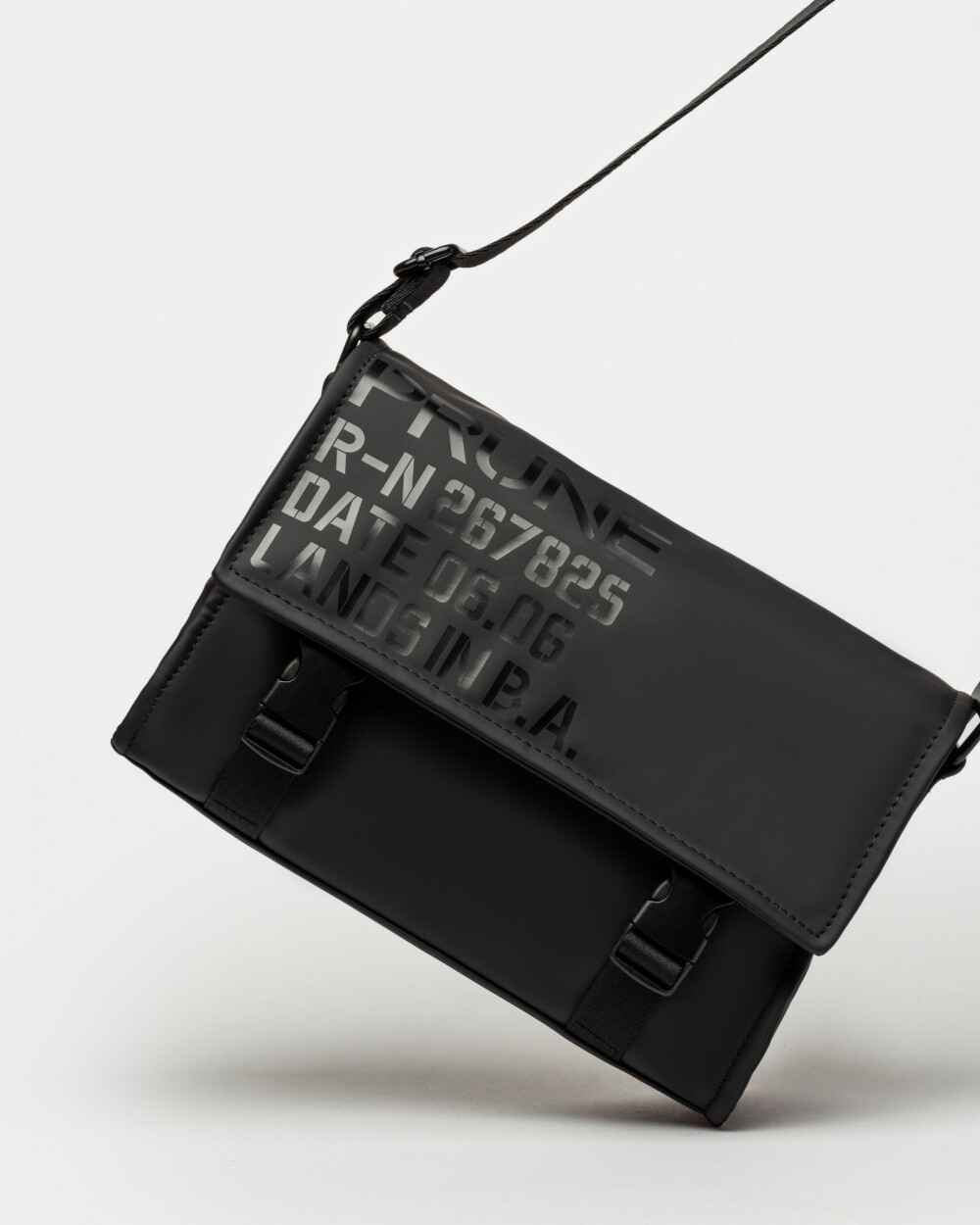 Bandolera Daily en efecto cuero rubber Negro
