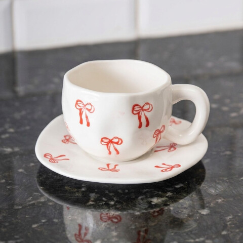Taza de cerámica moños 350ml Taza de cerámica moños 350ml