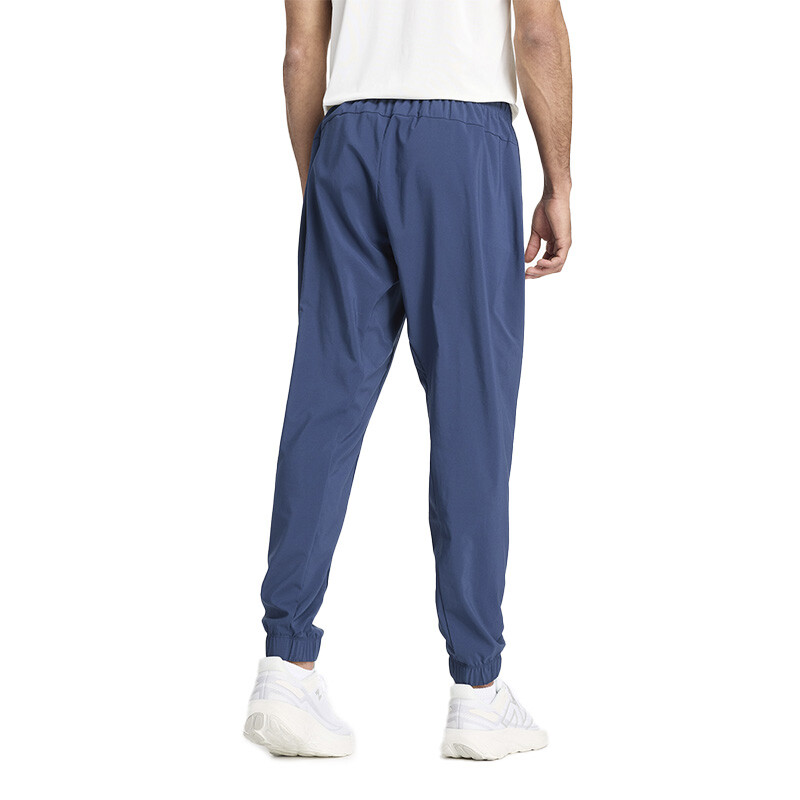 Pantalón New Balance Sport Essentials Woven Jogger Azul