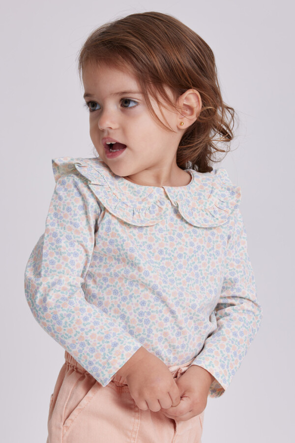 Remera manga larga cuello Flores Crema