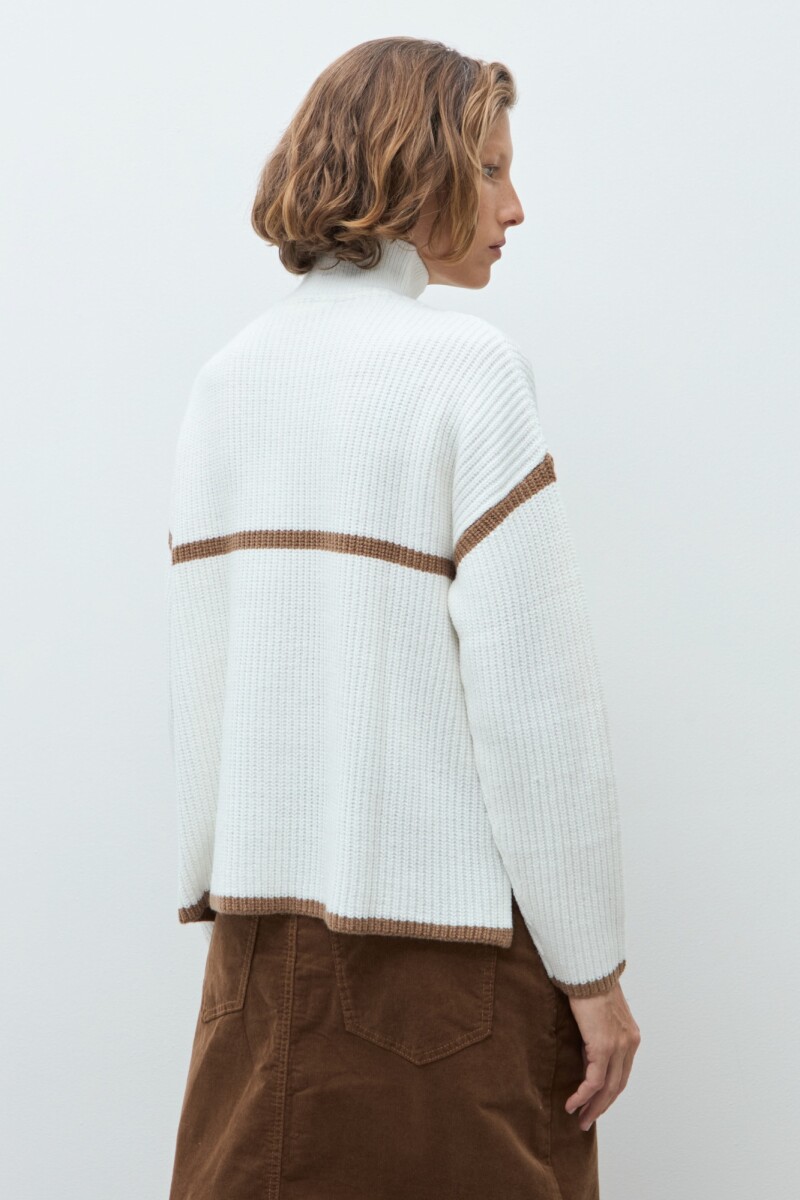 Sweater vivo en contraste crudo