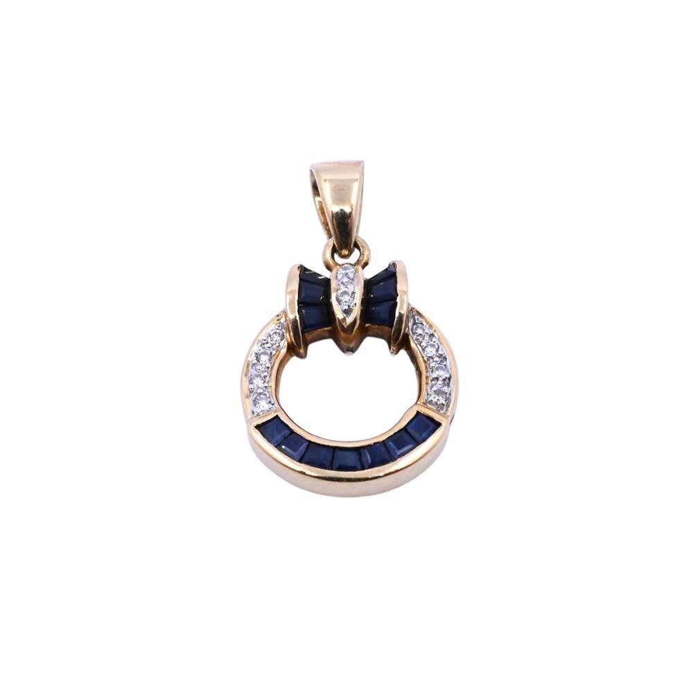 Dije oro 18k con zafiros y brillantes. Dije oro 18k con zafiros y brillantes.