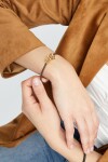 PULSERA DE CUERO MARRÓN CON MOSQUETÓN ENTRELAZADO BAÑADO EN ORO 18K Pulsera