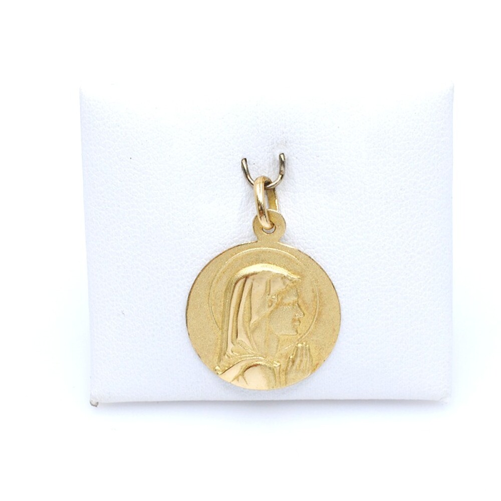 Medalla en oro 18k amarillo, con virgen. Diámetro 18mm Medalla en oro 18k amarillo, con virgen. Diámetro 18mm