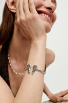 PULSERA RÍGIDA ALEACIÓN DE METALES BAÑADO EN PLATA CON DETALLE DE ALAS EN LOS EXTREMOS Pulsera