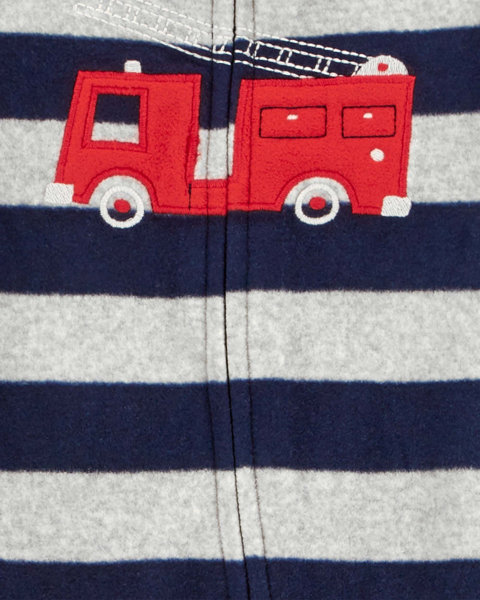 Pijama una pieza de micropolar, con pie, estampa bombero. Talles 0-9M Pijama una pieza de micropolar, con pie, estampa bombero. Talles 0-9M