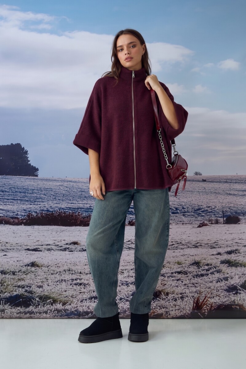 Poncho con cierre bordo