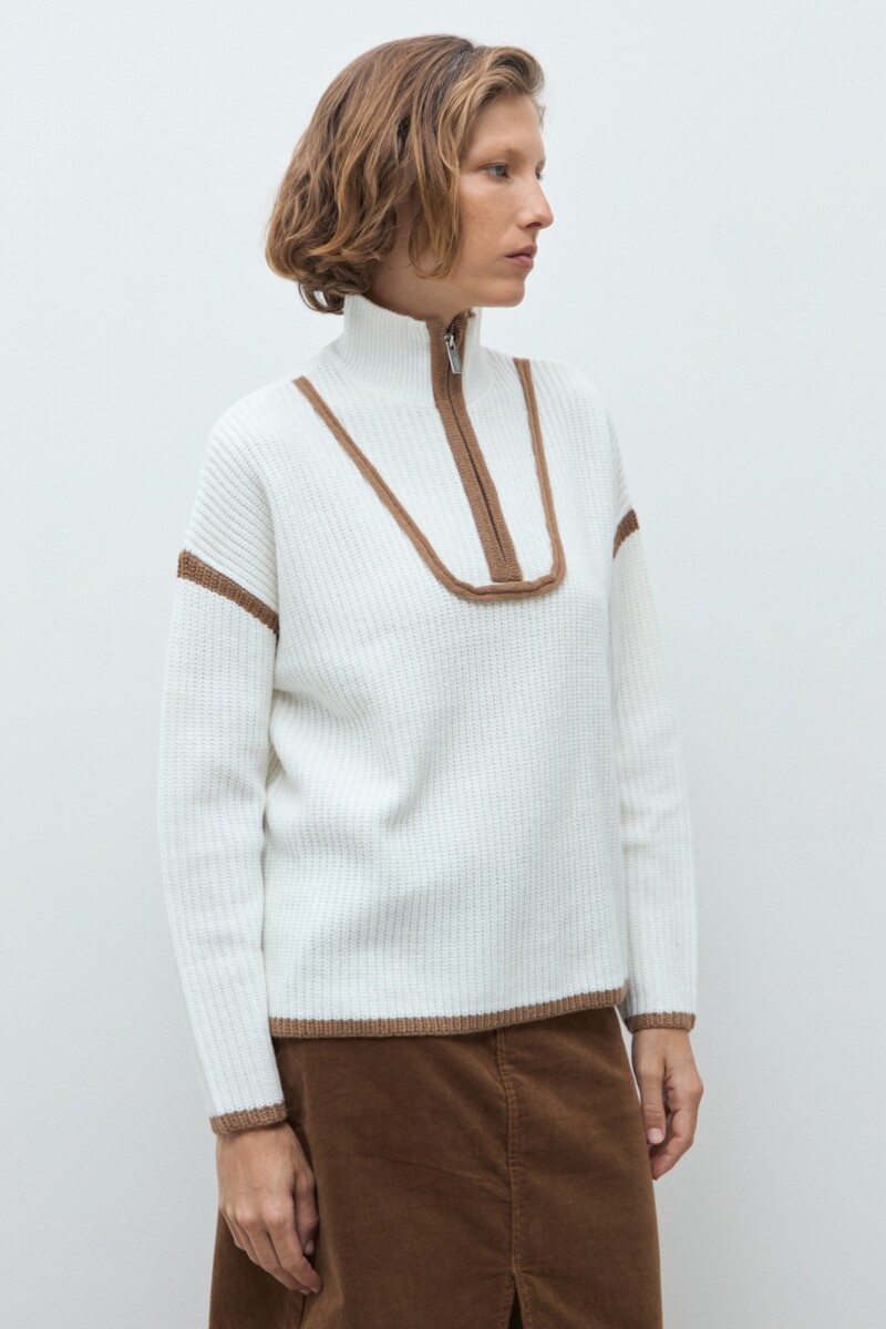 Sweater vivo en contraste crudo